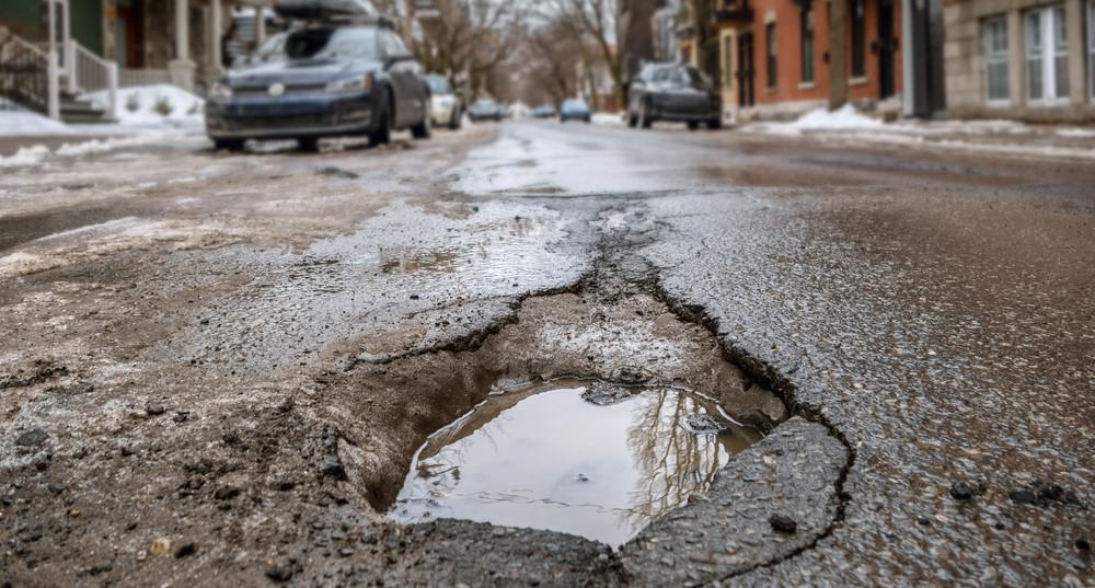 pothole in the middle of the street how to avoid it