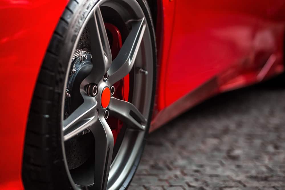 close up of a  tire on a red car