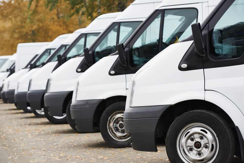 commercial delivery vans in row at parking