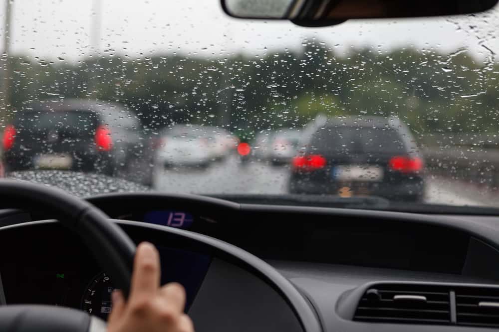 car driving in the rain on highway