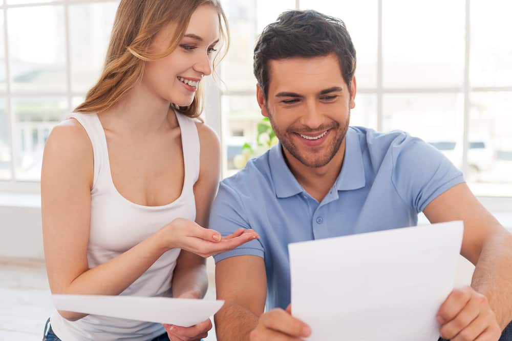 young couple reviewing life insurance plans