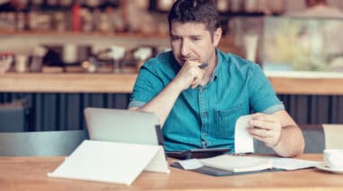 business owner going over financials on computer