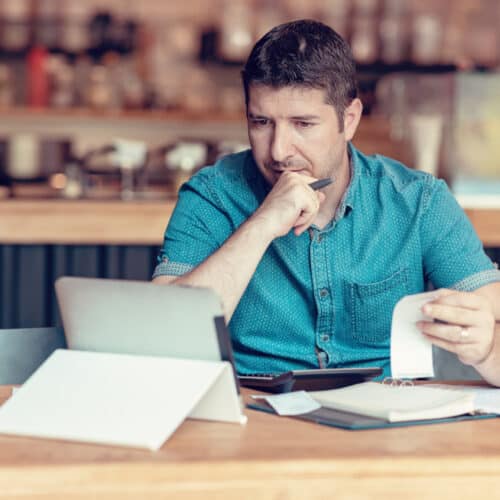 business owner going over financials on computer