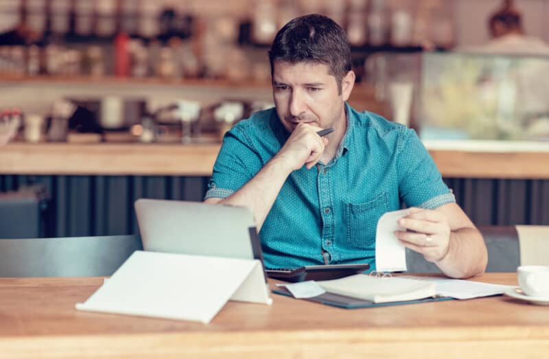 business owner going over financials on computer