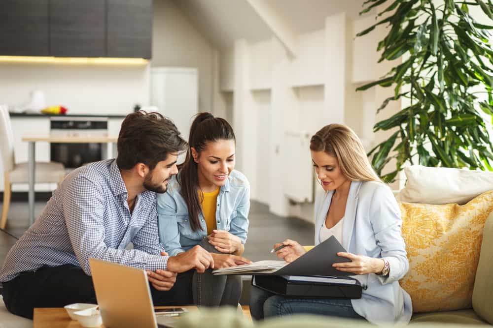 couple speaking with insurance agent about life insurance