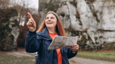 Women with red hair happily exploring on a road trip in Washington