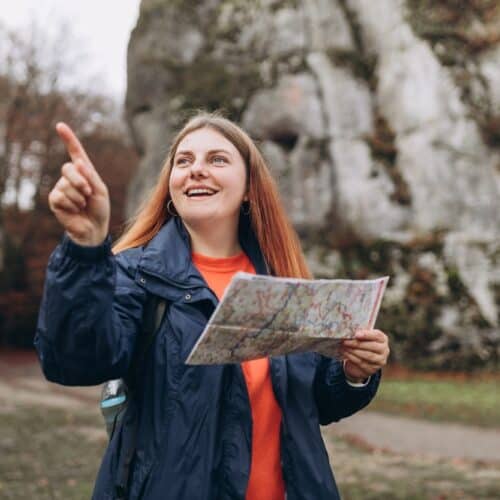 Women with red hair happily exploring on a road trip in Washington