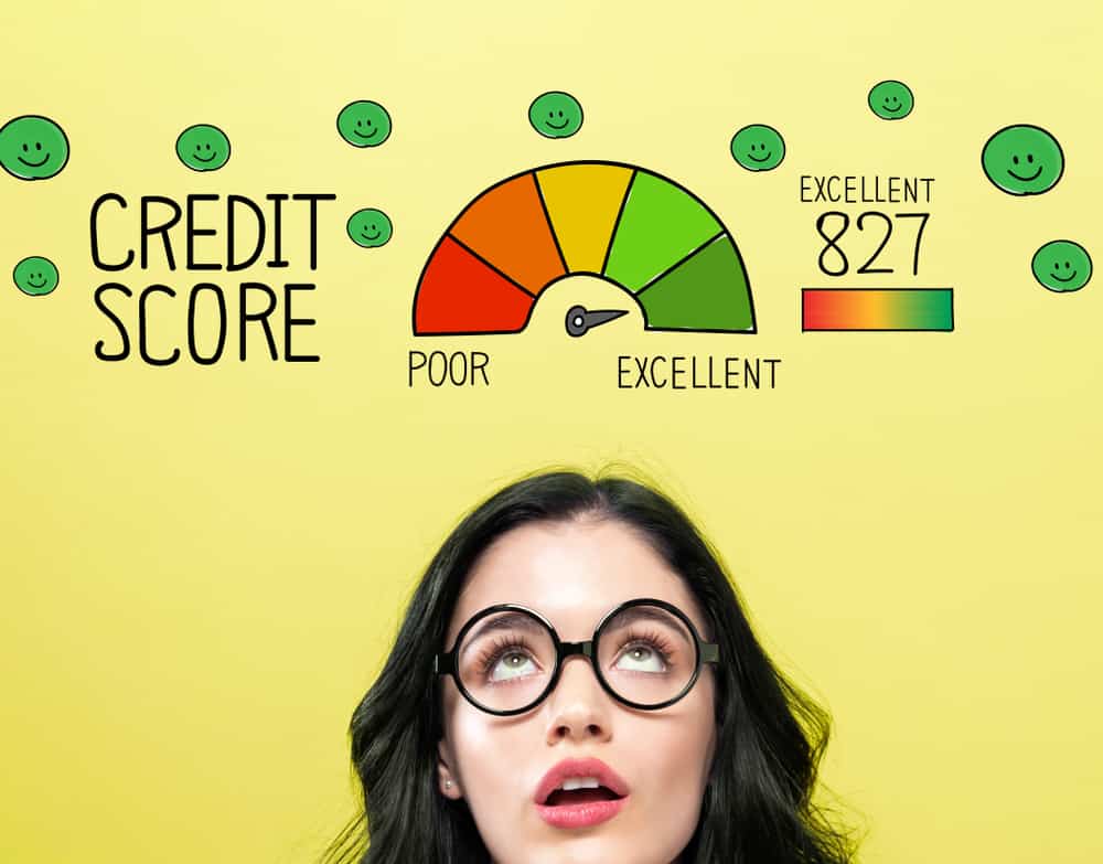 woman looking up at graphic of her excellent credit score