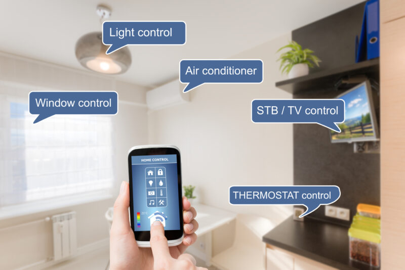 Illustration of using a remote control to save energy in your apartment
