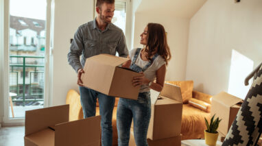 Young smiling couple moving into their new apartment in Seattle