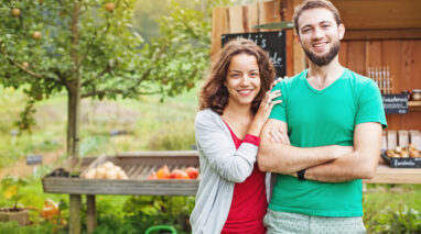 Young couple with home out in the country