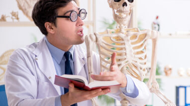 Medical professional explaining health insurance terms to skeleton - health insurance in Washington