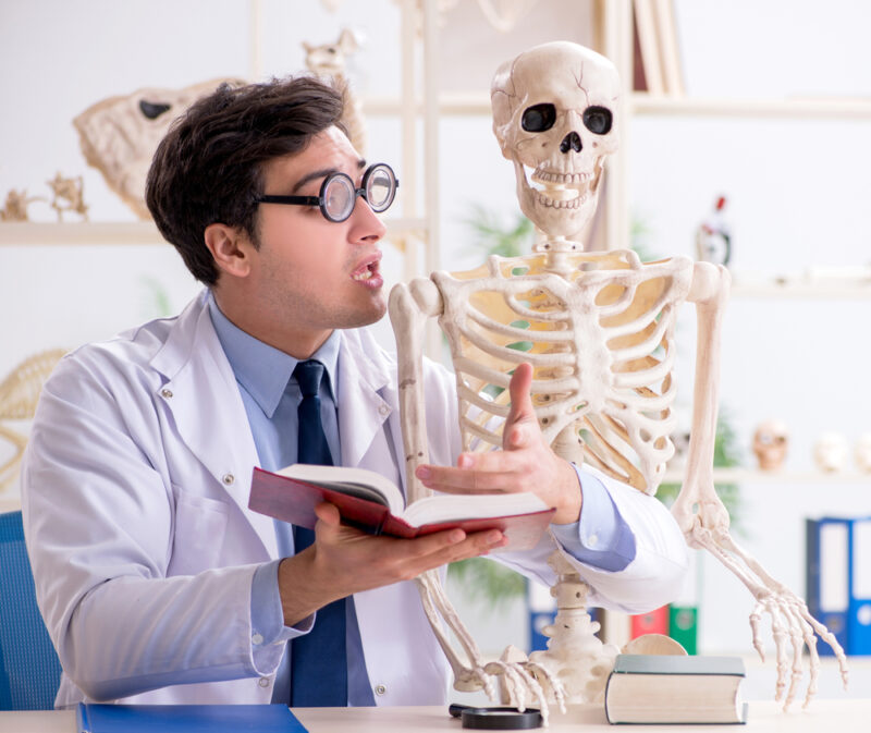 Crazy,Professor,Studying,Human,Skeleton Medical professional explaining health insurance terms to skeleton - health insurance in Washington