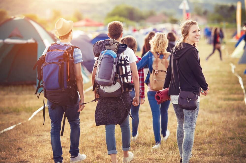Group of young people heading into a music festival in the Washington State area.