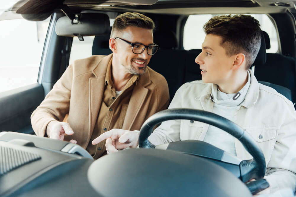 Father teaching son to drive, buying insurance for a car not in your name - cheap car insurance in Washington.