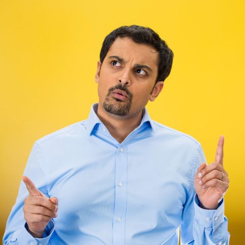 Man with yellow background trying to decide if he should switch car insurance companies - cheap car insurance in Washington.