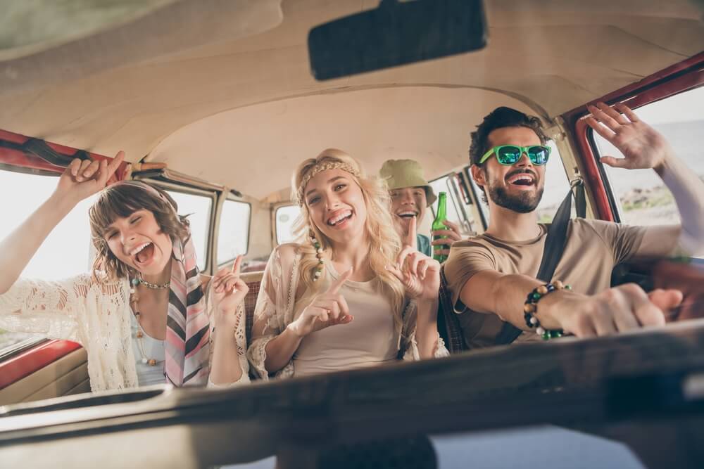 Bunch of young people in the car, having a good time - cheap car insurance in Washington.