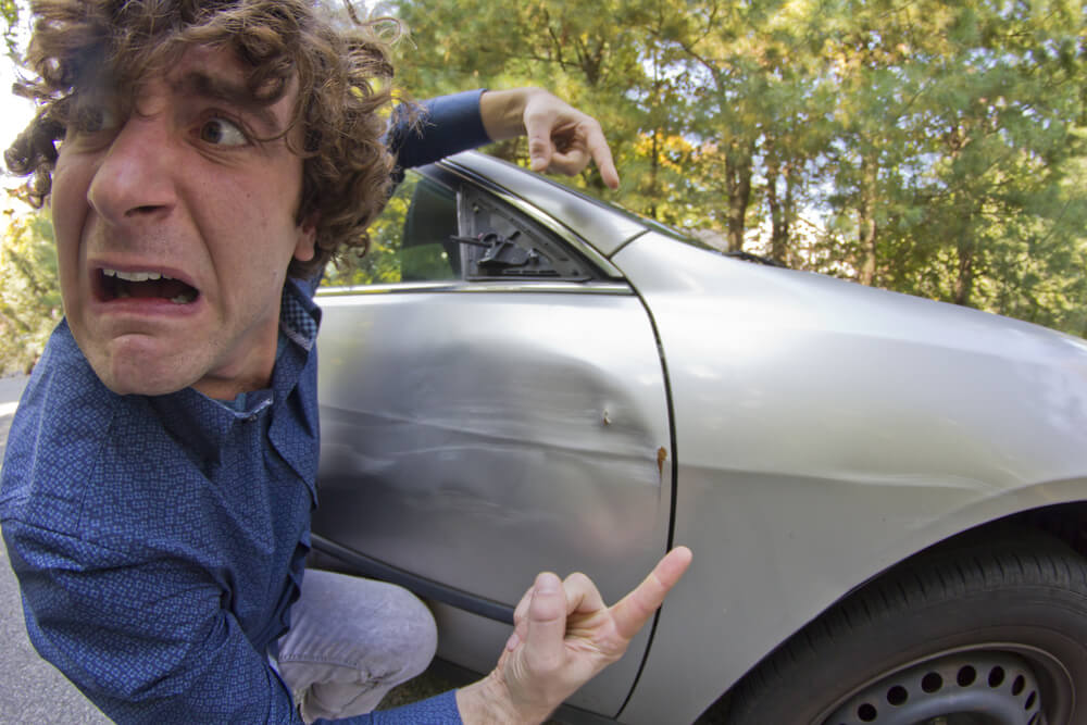 Silly man gets into car crash and makes ridiculous face, cheap car insurance coverage in Washington.
