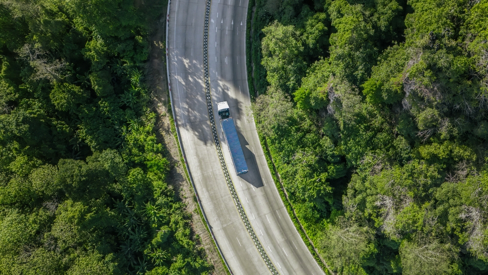 A semi-truck makes it way on a hill in the Pacific Northwest.