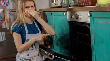 Young girl burning cake.
