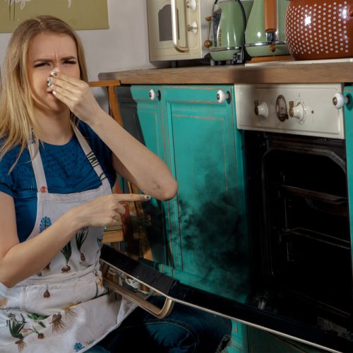 Young girl burning cake.
