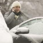 Woman on a Cell Phone in a Snow Storm