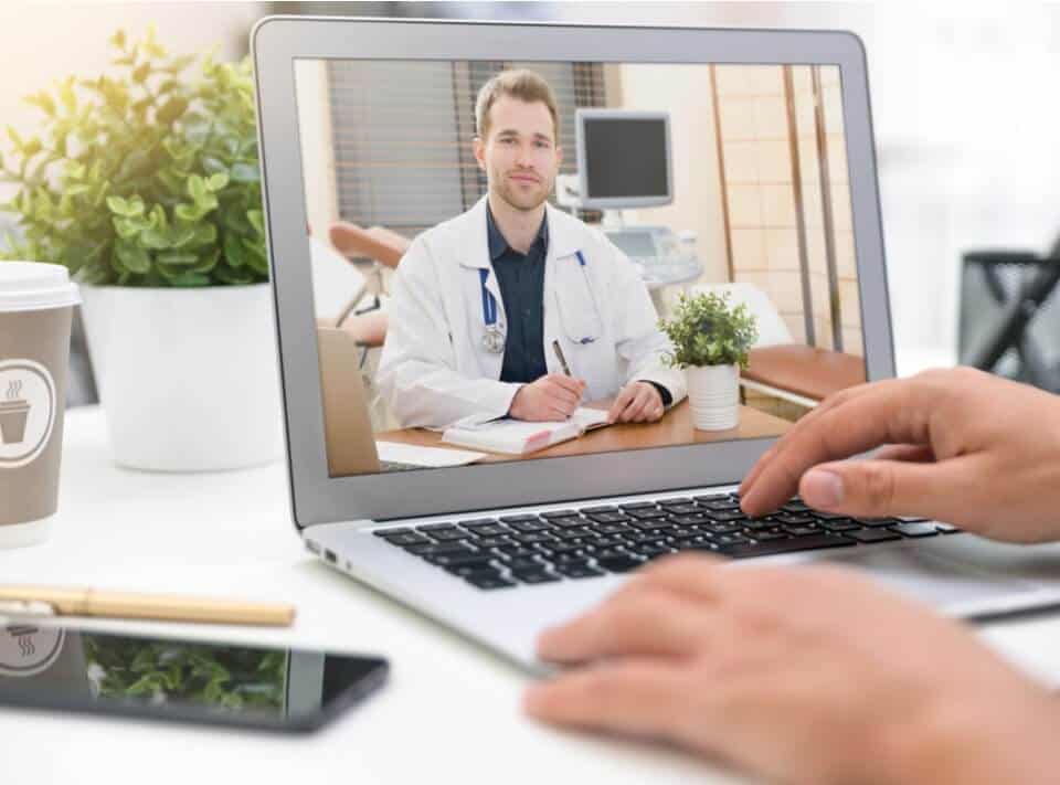 patient talking to doctor using laptop video chat with telemedicine